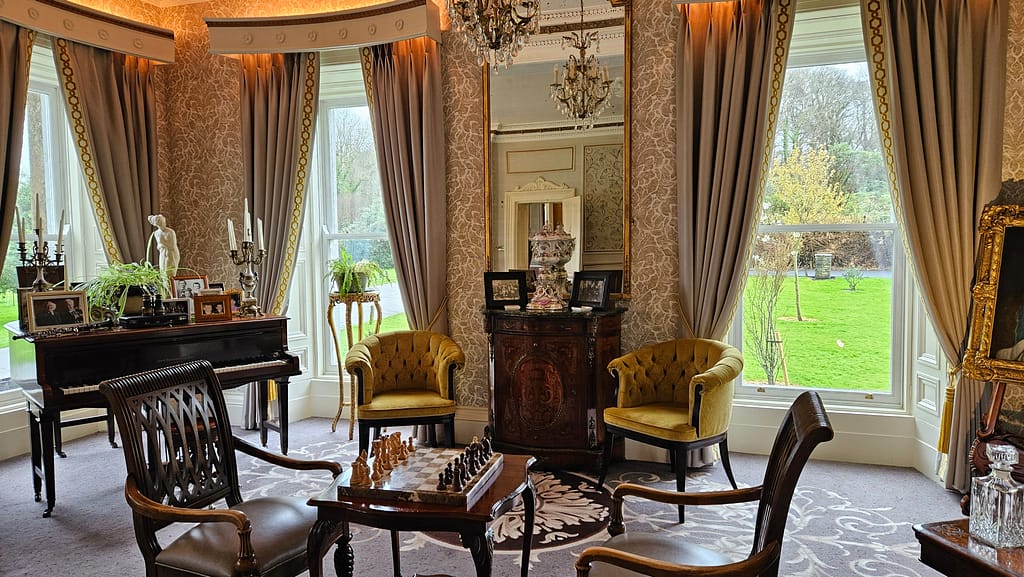 A piano and chess board call visitors to play