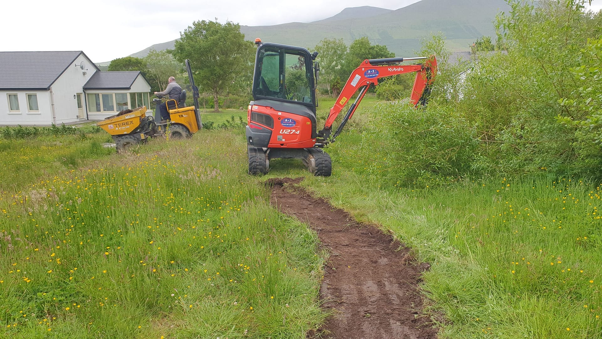 Digging out the pathway through the property