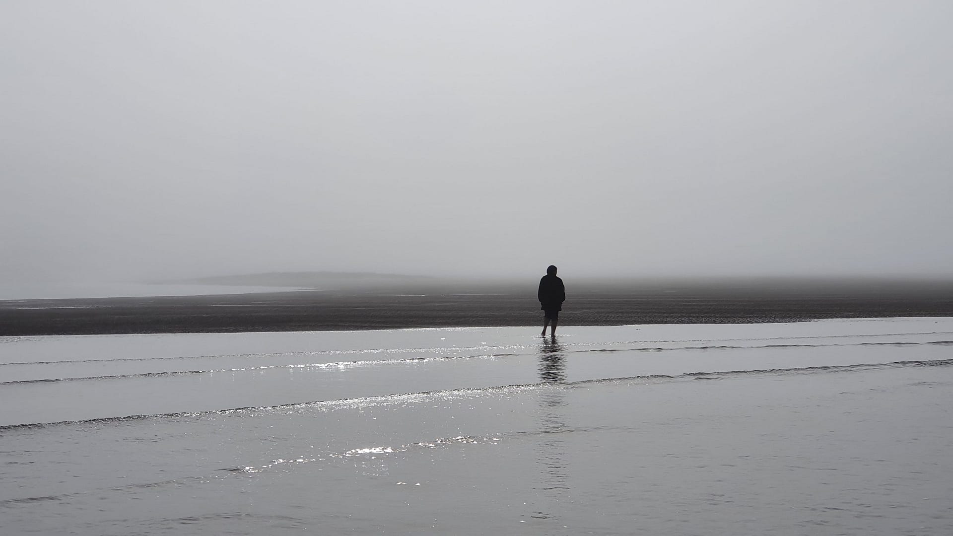 Clarice walking in the fog on Brandon Bay