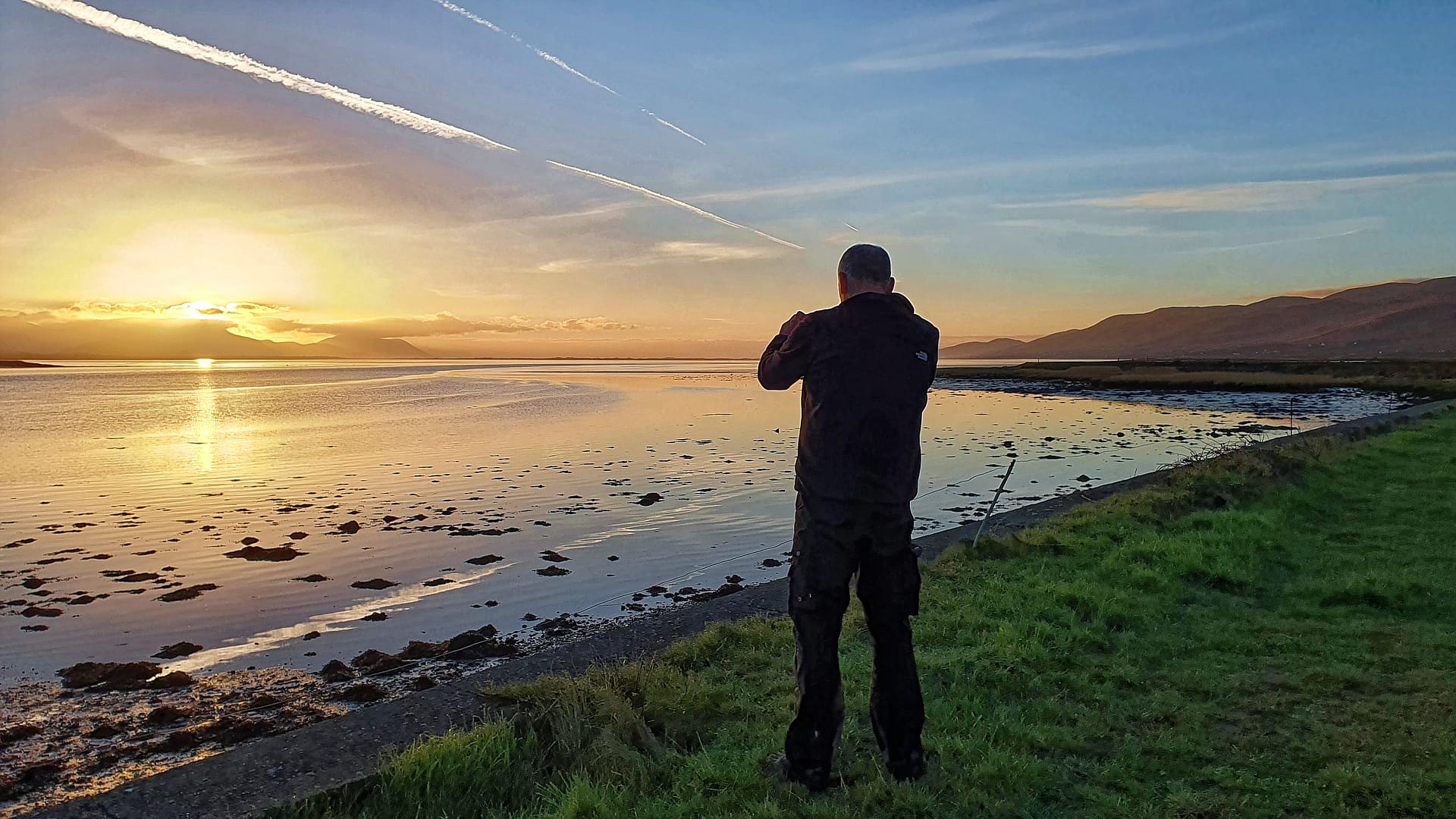 Gerhard photographing sunset on Castlemaine Harbour