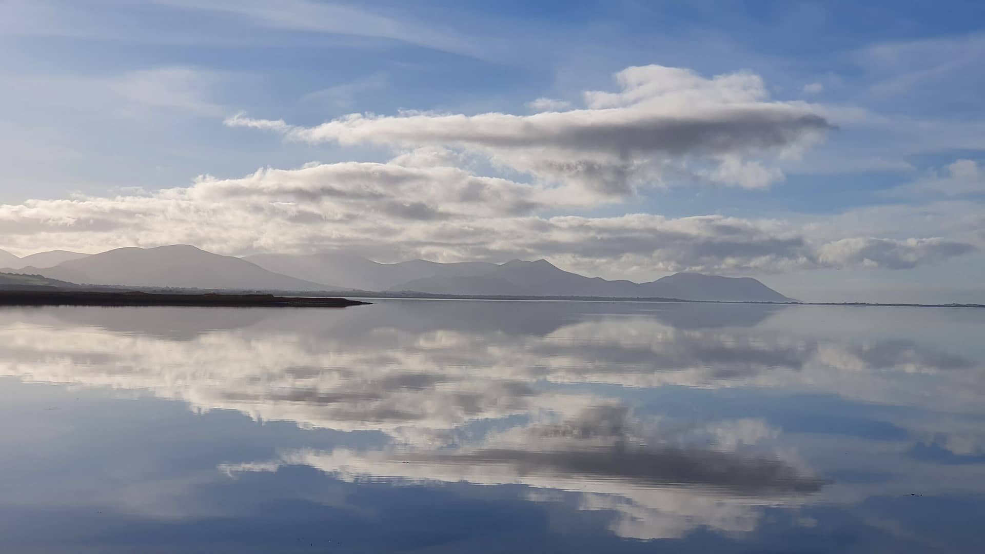 Reflections of the ever-changing skies and landscapes in the waters of Castlemaine Harbour 